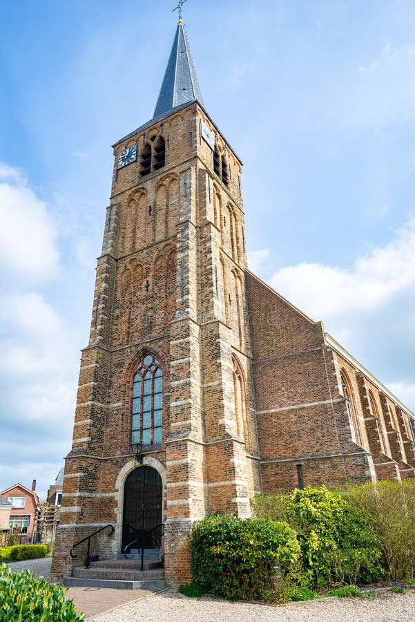 Large tower of an ancient protestant church in Nieuwerkerk aan den IJssel, The Netherlands. Large tower of an ancient protestant church in Nieuwerkerk aan den IJssel, The Netherlands.