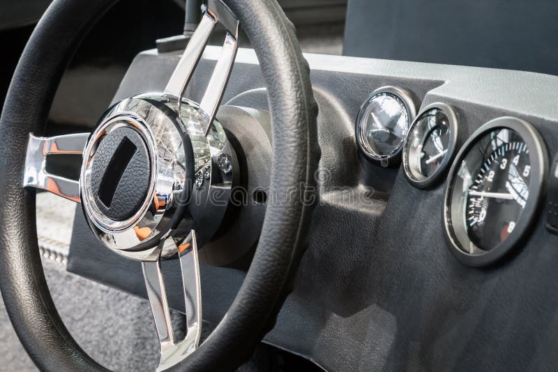Steering Wheel on the Dashboard of a Boat or Motor Boat Stock Image