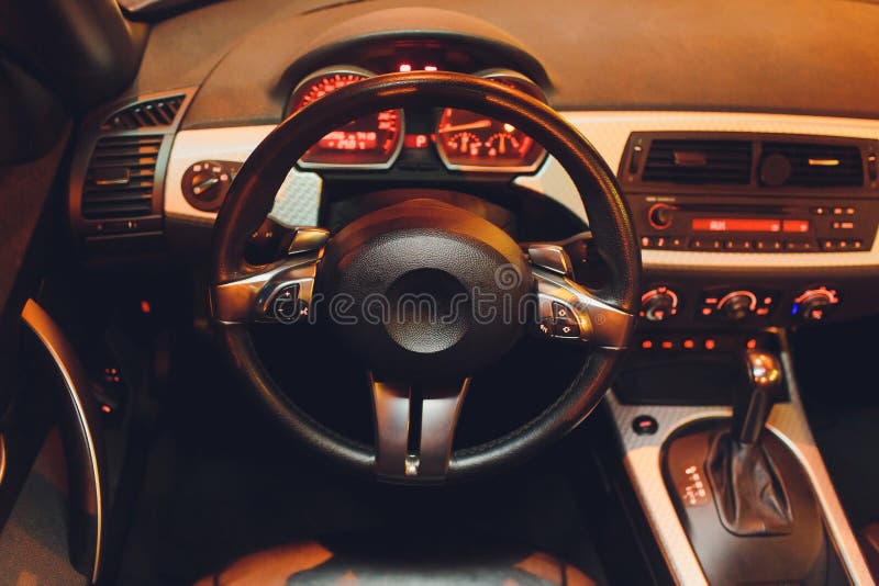 The Steering Wheel and the Instrument Panel on the Dashboard of the Car