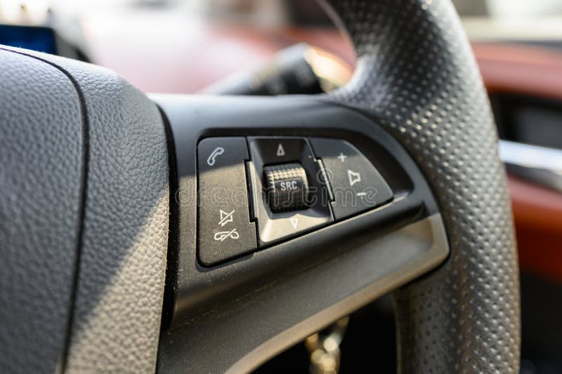 Steering wheel with sound control button royalty free stock images