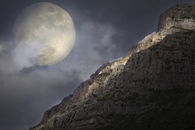 Artistic concept of the full moon rising over the Pindus mountain range in north-west Greece. Artistic concept of the full moon rising over the Pindus mountain range in north-west Greece