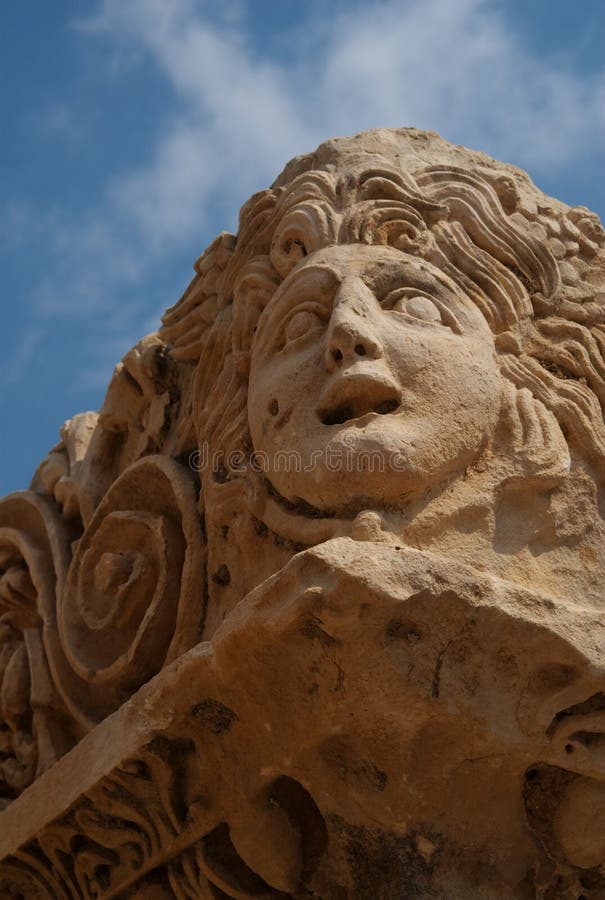 A stone drama mask carved in the wall of the theater in Myra, Turkey. A stone drama mask carved in the wall of the theater in Myra, Turkey