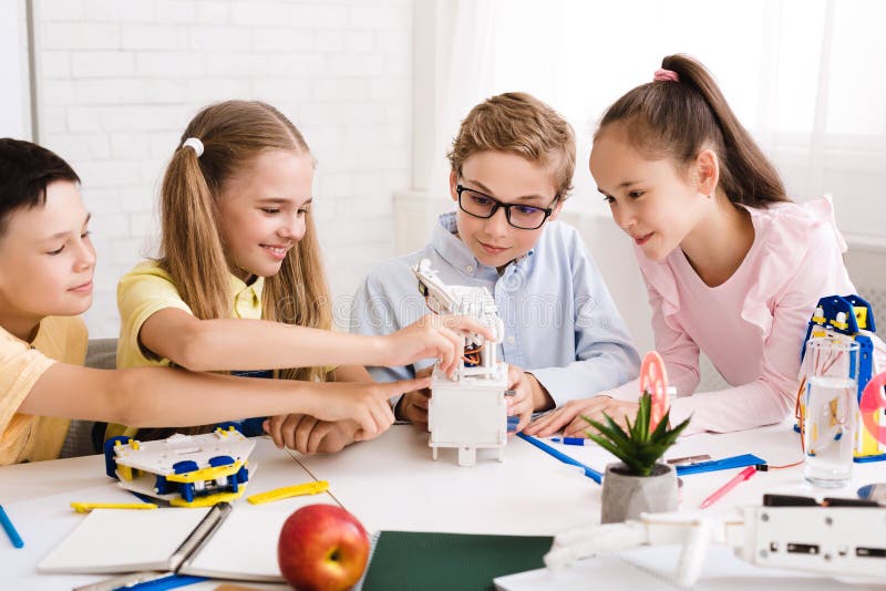 Stem education. Children creating robots at class royalty free stock photography