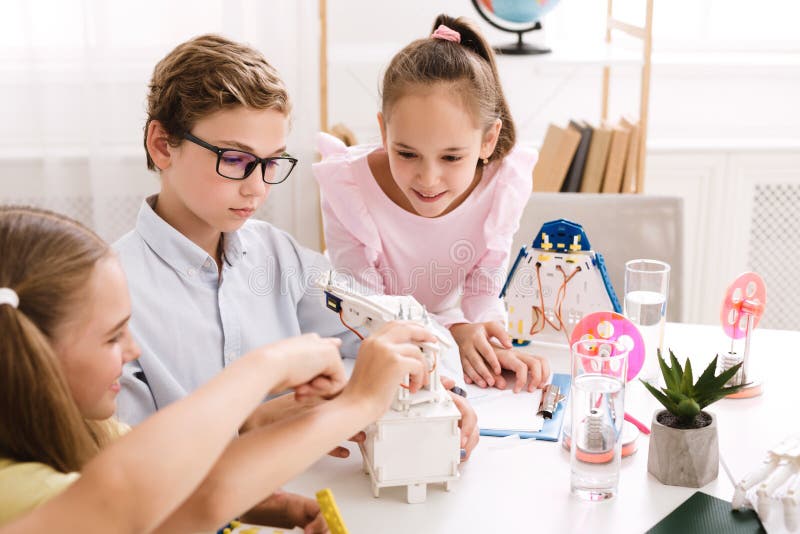Stem education. Children creating robots at school royalty free stock images