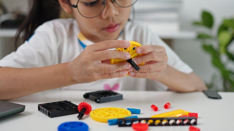 STEM education concept. Asian home school girls self-study online lessons and are excited to make STEM toys. mathematics stock photography