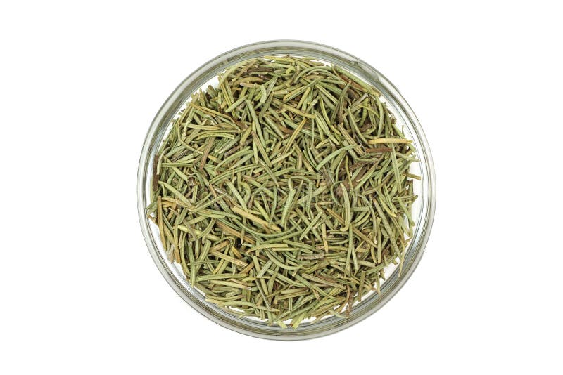 The stems of dried rosemary in a glass cup royalty free stock photo