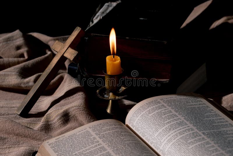 Classic still life with vintage books placed with illuminated