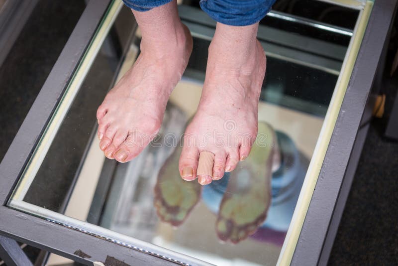Step Digital Foot Scan, Orthotics Foot Scan for Custom Made Shoe Insoles, Posture and equilibrium analysis. Doctor, patient stock photos Step Digital Foot Scan, Orthotics Foot Scan for Custom Made Shoe Insoles, Posture and equilibrium analysis. Doctor, patient stock photos