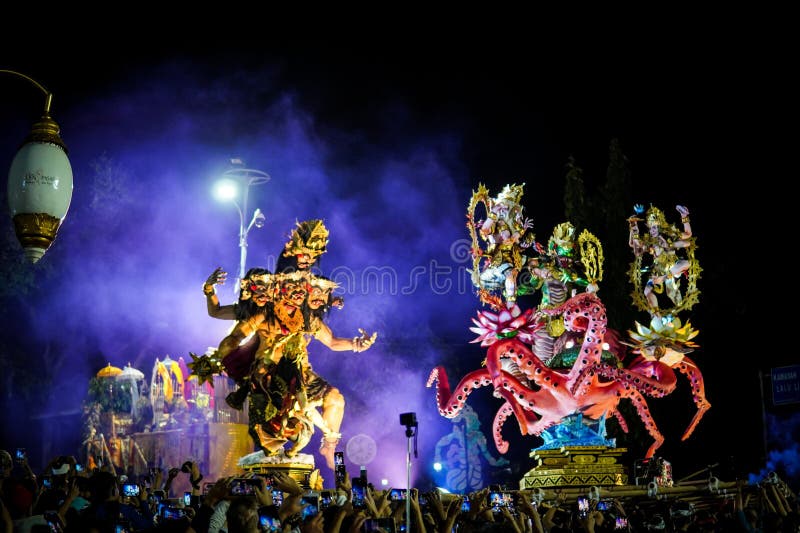 Step into the heart of Balinese tradition with this captivating snapshot of the Ogoh-Ogoh parade in Catur Muka,Denpasar,Bali. As the rhythmic beat of drums fills the air,larger-than-life mythological figures come to life,each intricately crafted to embody ancient tales and spiritual forces. Against the backdrop of the vibrant sunset,the parade unfolds like a moving canvas of colors,emotions,and collective energy. This photograph encapsulates the essence of cultural devotion,as the community unites to honor their roots and propel these mesmerizing creations through the streets,bringing a surge of artistic,spiritual,and communal vitality to the heart of Bali. Step into the heart of Balinese tradition with this captivating snapshot of the Ogoh-Ogoh parade in Catur Muka,Denpasar,Bali. As the rhythmic beat of drums fills the air,larger-than-life mythological figures come to life,each intricately crafted to embody ancient tales and spiritual forces. Against the backdrop of the vibrant sunset,the parade unfolds like a moving canvas of colors,emotions,and collective energy. This photograph encapsulates the essence of cultural devotion,as the community unites to honor their roots and propel these mesmerizing creations through the streets,bringing a surge of artistic,spiritual,and communal vitality to the heart of Bali.