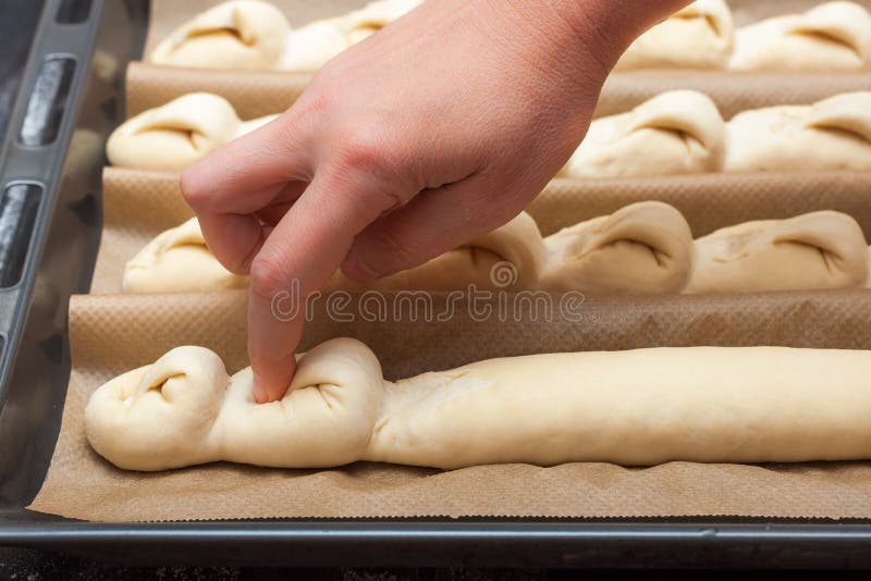 Step by step preparation of bread. French baguette. Forming `Tail of the Dragon`. bread cooking. Step by step preparation of bread. French baguette. Forming `Tail of the Dragon`. bread cooking