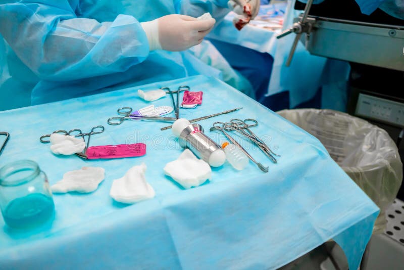 Sterile Surgical Instruments and Glass Containers with Solutions on the