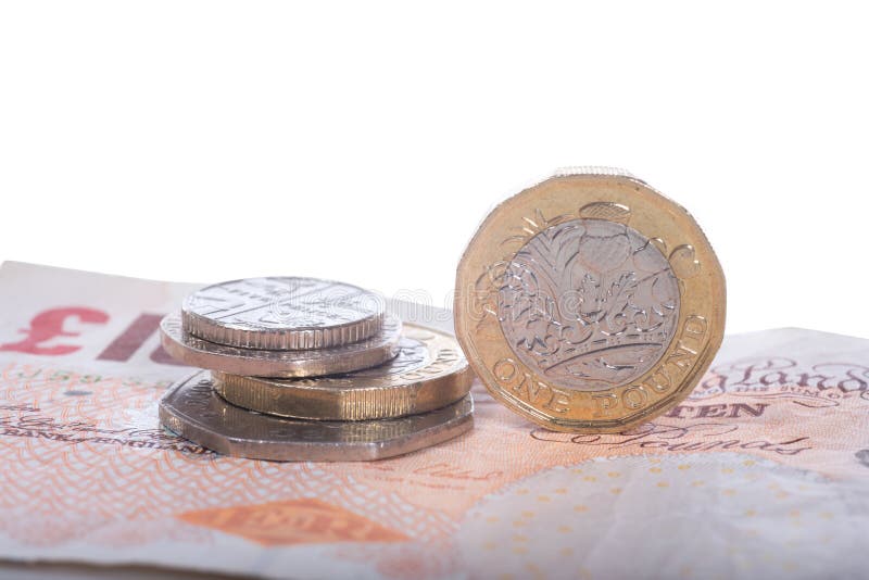 Sterlingsbanknoten und -münzen des britischen Pfunds stockfoto Sterlingsbanknoten und -münzen des britischen Pfunds stockfoto