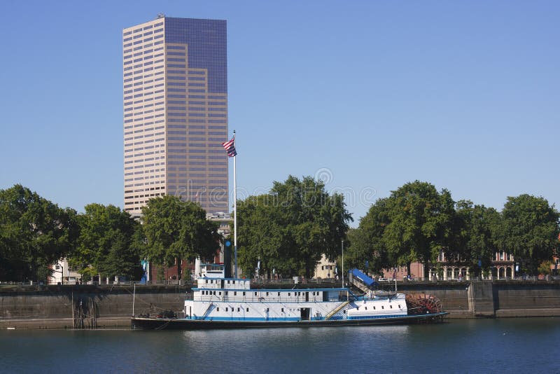 Stern wheeler & a skyscraper.