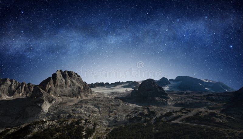 Milky way in starry night sky above a mountain landscape. Milky way in starry night sky above a mountain landscape