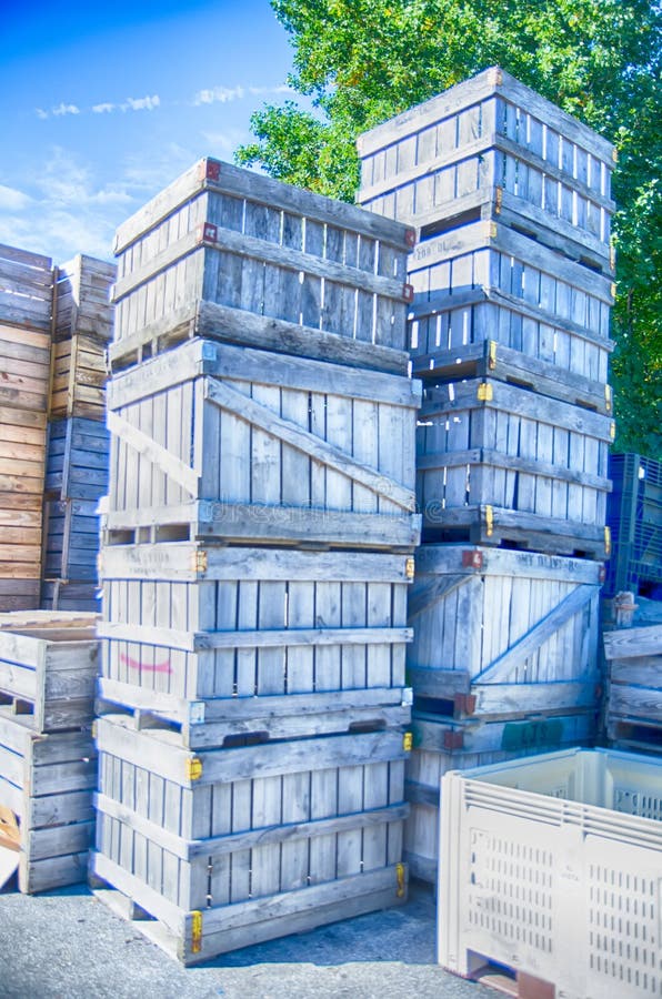 Stack of fruit boxes or crates sit outside a warehouse. Stack of fruit boxes or crates sit outside a warehouse