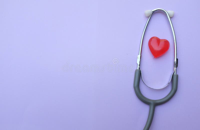 Close Up Stethoscope and Red Heart on Purple Background Medical ...