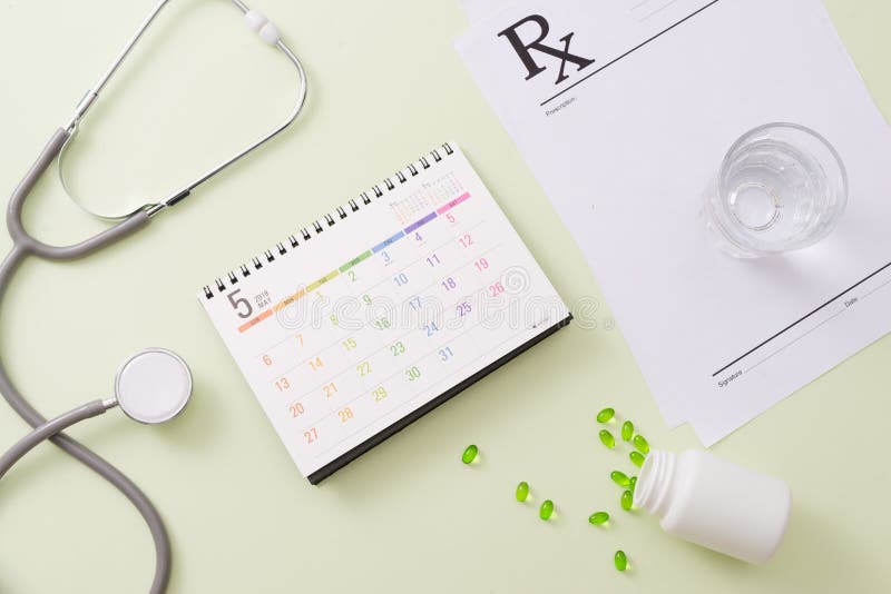 Stethoscope with drugs and pills on calendar page royalty free stock image Stethoscope with drugs and pills on calendar page royalty free stock image
