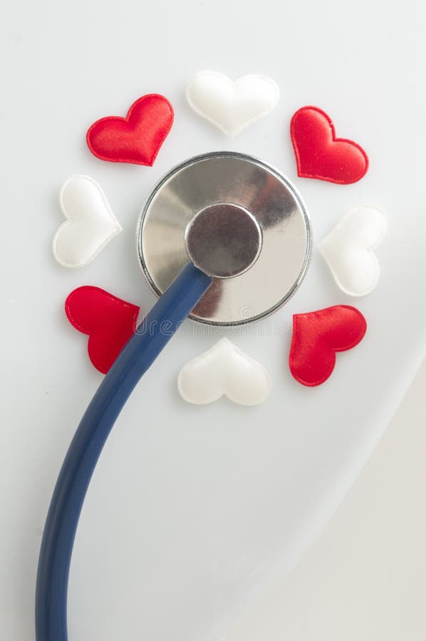 Healtcare Concept Stethoscope and Fabric Hearts in a Flower Shape