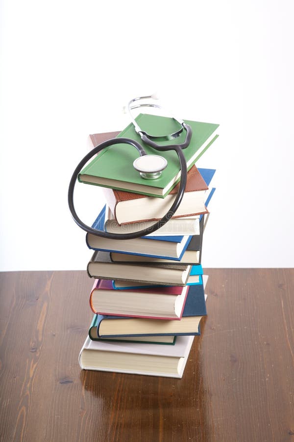 Stethoscope on heap of books