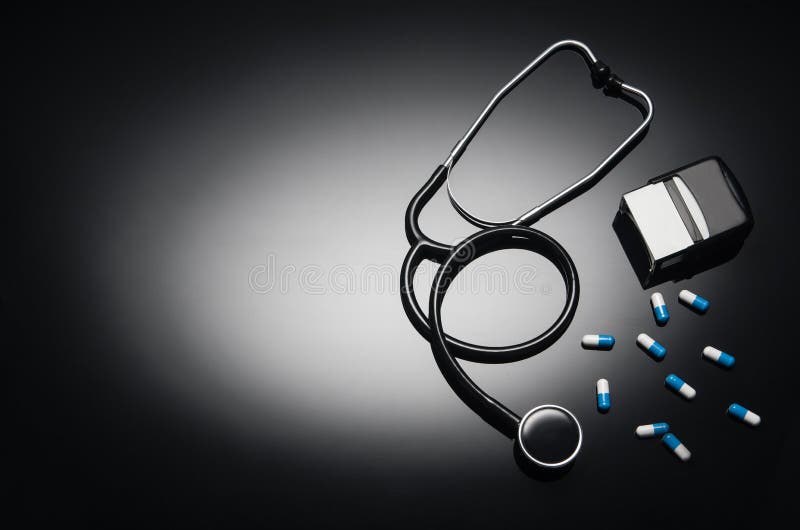 Stethoscope Isolated On Black Background Top View Photograph