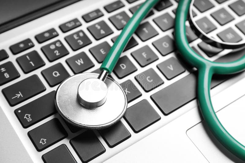 Stethoscope on laptop, closeup. Concept of technical support. Stethoscope on laptop, closeup. Concept of technical support