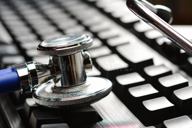 Stethoscope or phonendoscope on computer keyboard. Medical Information and technology concept, close-up