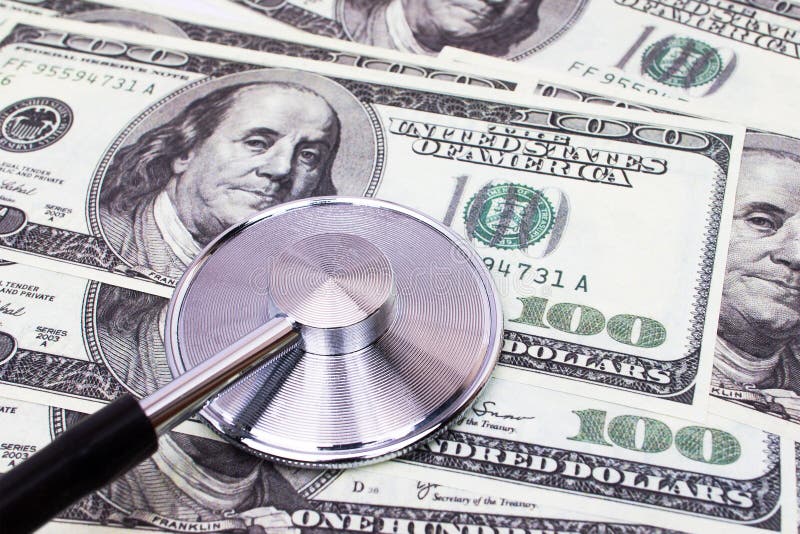 Stethoscope on top of a USD dollars diagnosing the currency