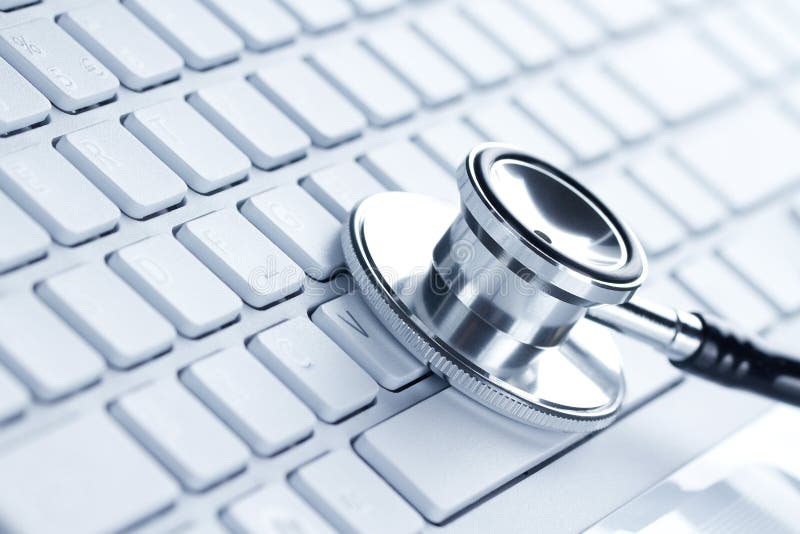 Silver stethoscope lying down on a laptop, toned blue. Silver stethoscope lying down on a laptop, toned blue