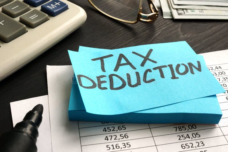 Tax deduction written on the piece of paper. Tax deduction written on the piece of paper