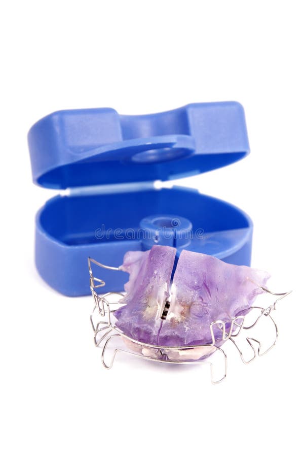 Lila braces and box in detail in front of a white background. Lila braces and box in detail in front of a white background