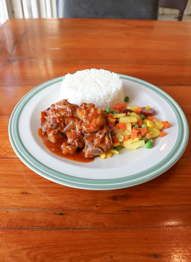 Stewed Pork ,pork with Rice and Sauce or Rice Topped with Stew Pork