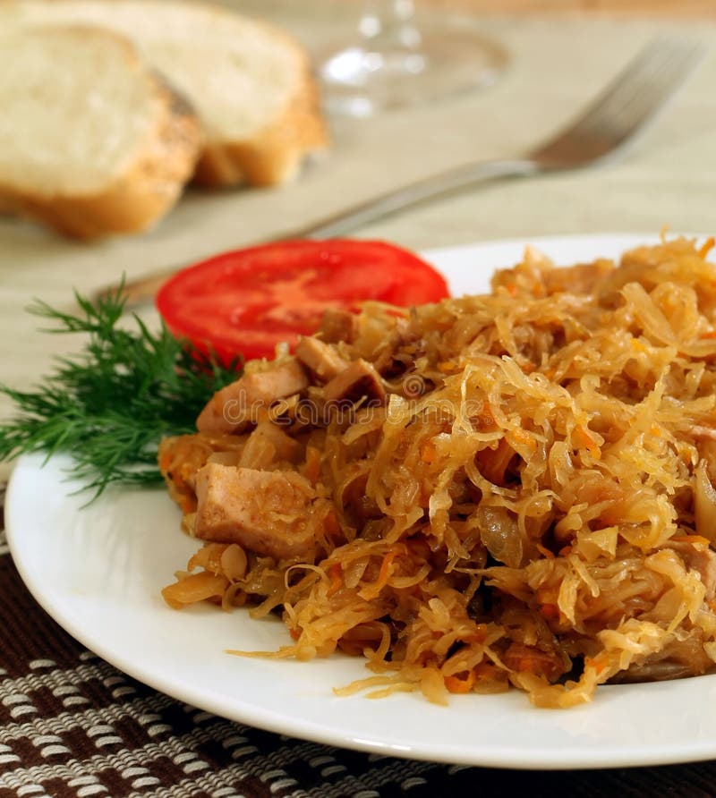 Stewed sauerkraut with sausage on a plate