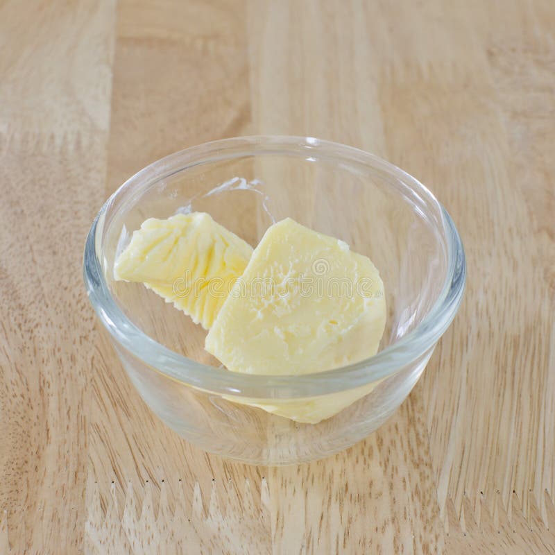 Stick of Butter, Cut, in Glass Bowl on Wood Table. Stock Image Image