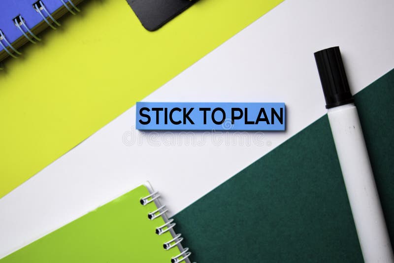 Stick To Plan text on sticky notes with office desk concept stock image