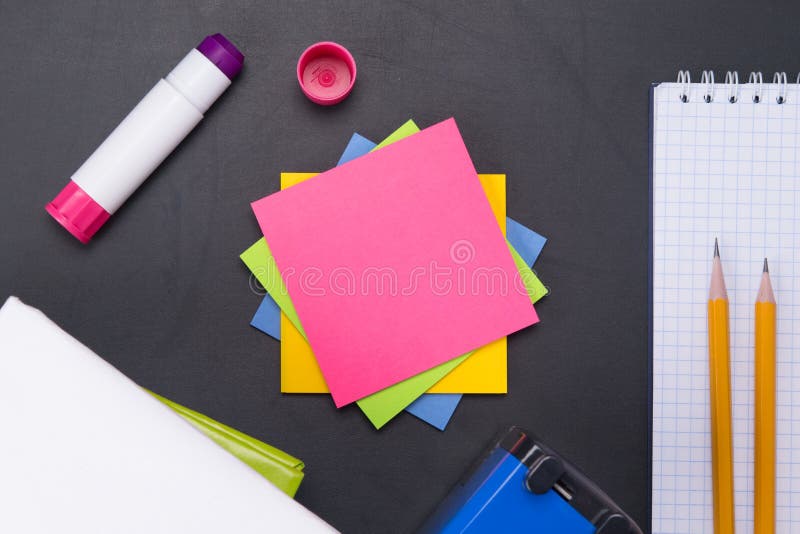 stickers for notes of pink color, on a black board in the form of a training background stock image stickers for notes of pink color, on a black board in the form of a training background stock image
