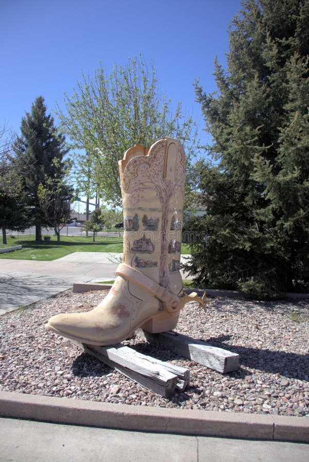 Boots of Cheyenne Springtime in Cheyenne artist Rose Burrows. Part of the boots collection located around town. Business located #1 Properties Sunny day with blue sky. Vehicles and parking lot. Boots of Cheyenne Springtime in Cheyenne artist Rose Burrows. Part of the boots collection located around town. Business located #1 Properties Sunny day with blue sky. Vehicles and parking lot.