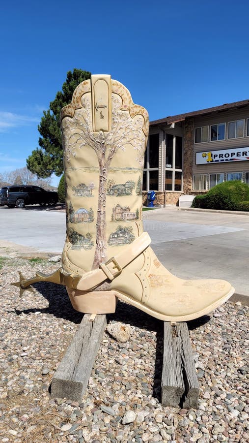 Boots of Cheyenne Springtime in Cheyenne artist Rose Burrows. Part of the boots collection located around town. Business located #1 Properties Sunny day with blue sky. Vehicles and parking lot. Boots of Cheyenne Springtime in Cheyenne artist Rose Burrows. Part of the boots collection located around town. Business located #1 Properties Sunny day with blue sky. Vehicles and parking lot.