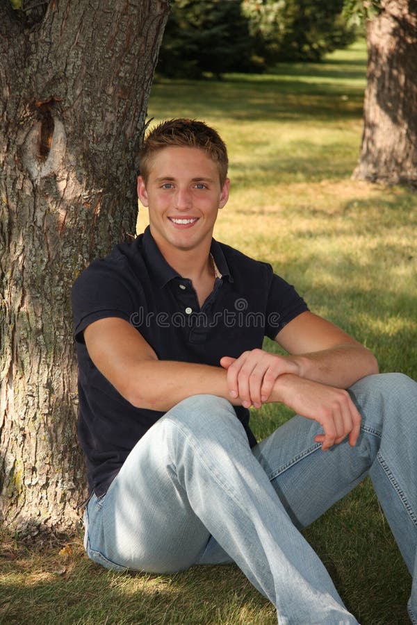 Casual outdoor portrait of young man smiling. Casual outdoor portrait of young man smiling