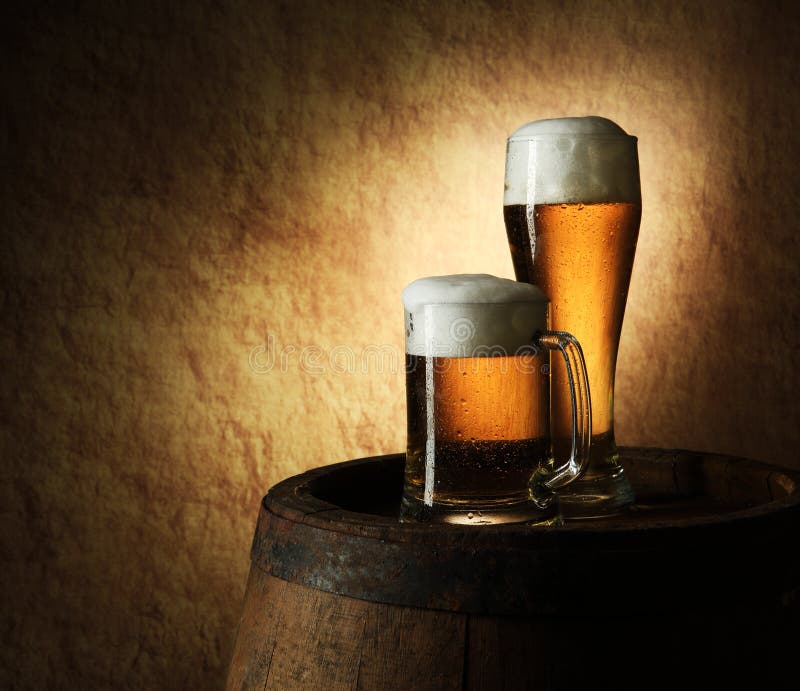 Still Life of beer and barrel on a old stone