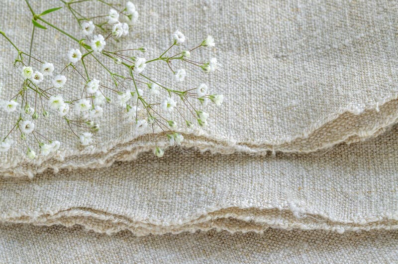 Still life with bouquet flowers on linen tablecloths