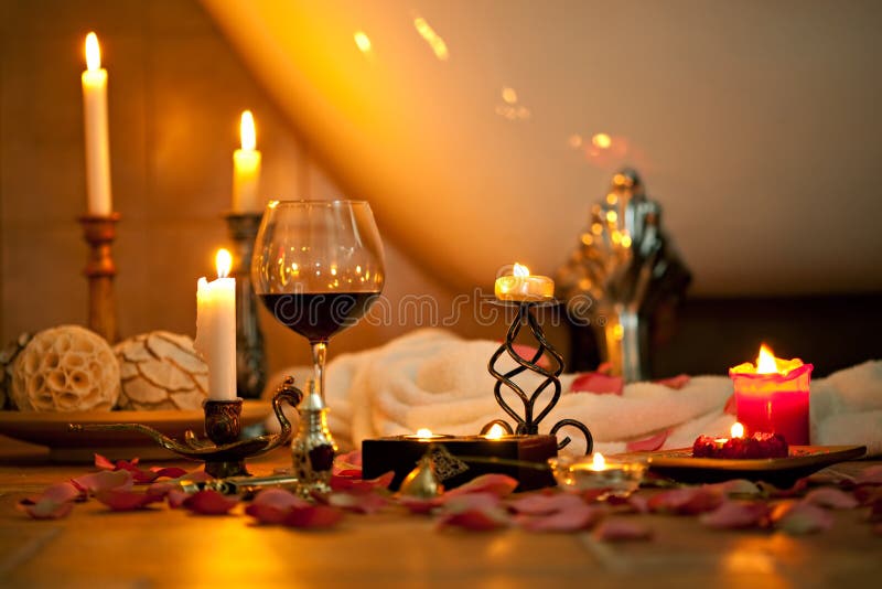 Still life with candles and red wine