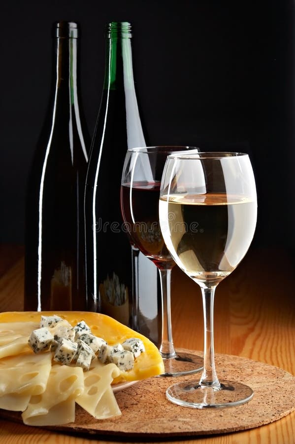 Still life with cheese, red and white wines