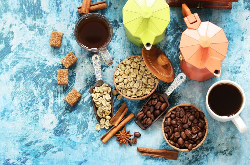 Still life of coffee - green and brown beans and spices