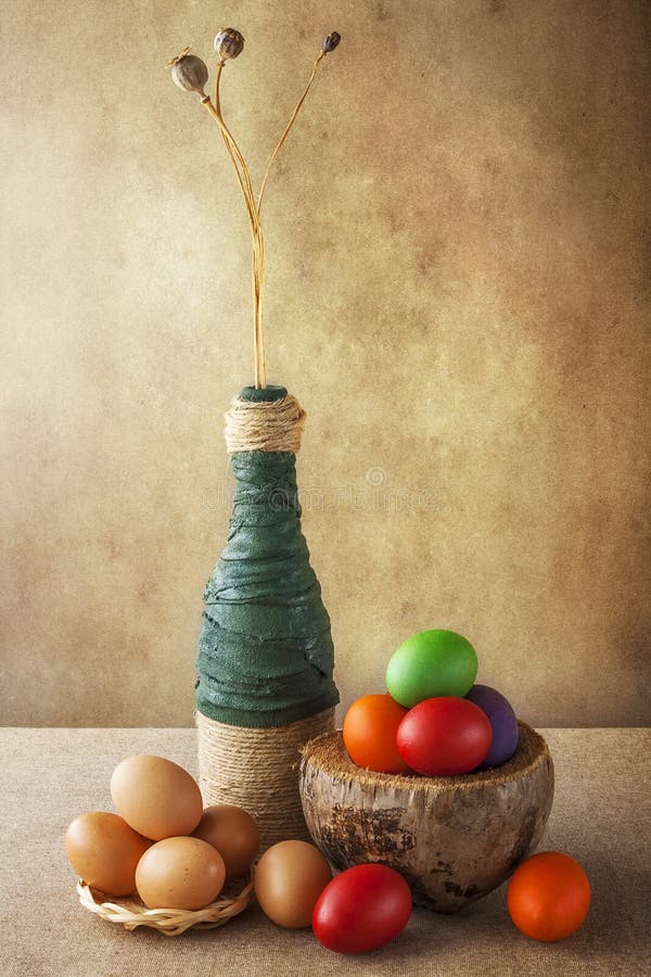 Still life colorful Easter eggs basket vase