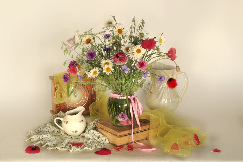 Still Life with Field Flowers ,vase and Books Stock Photo Image of