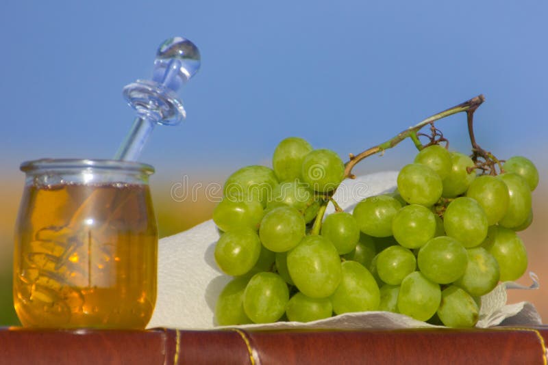 Still life with grapes and honey