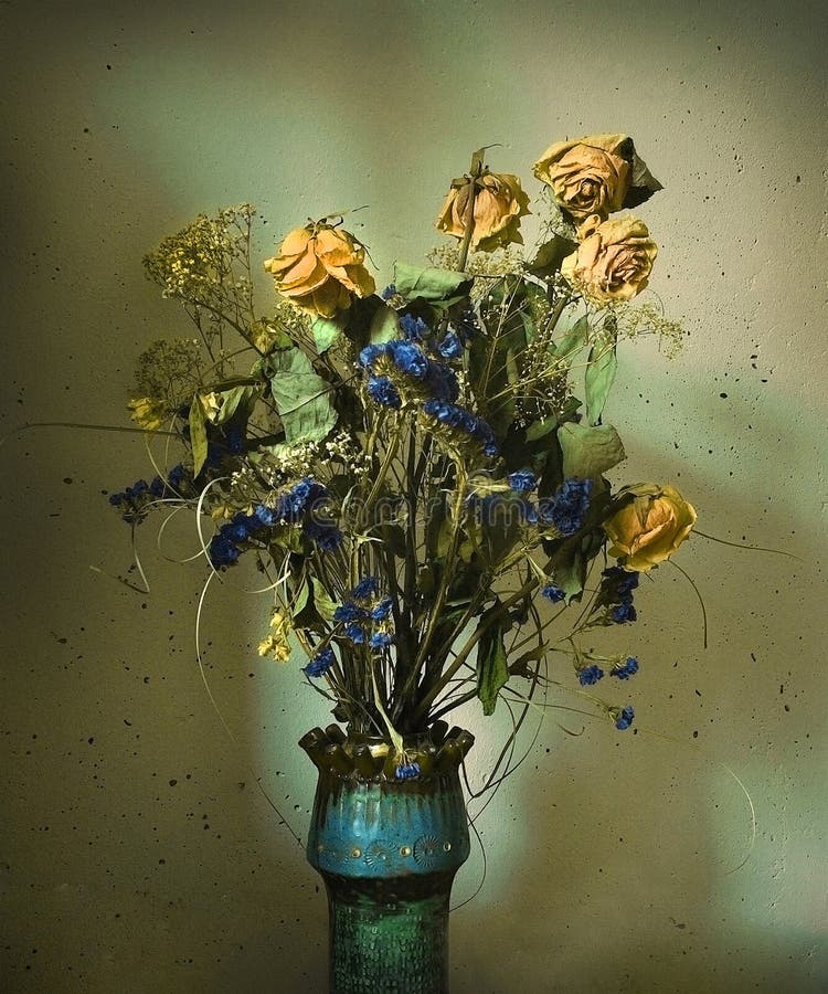 Still-life with mixed dry flowers bouquet in vase on grunge background