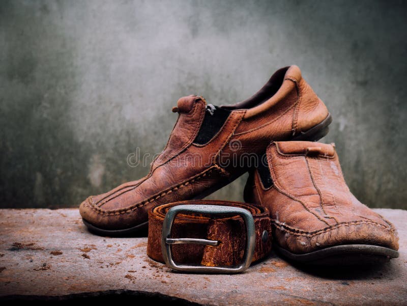 Still life old Leather shoes and belt. It more of dirty and sha