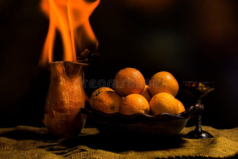 Still Life of Oranges and Flute with Fire Stock Photo Image of