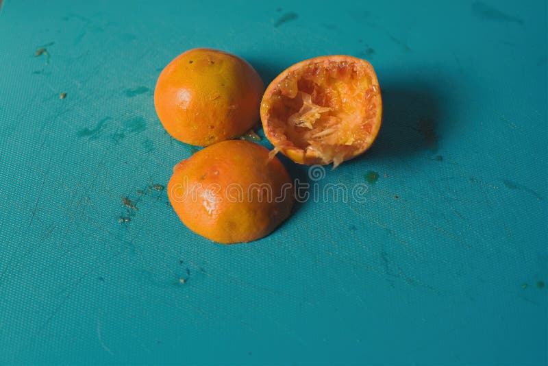 Oranges cut in half for preparation of orange juice